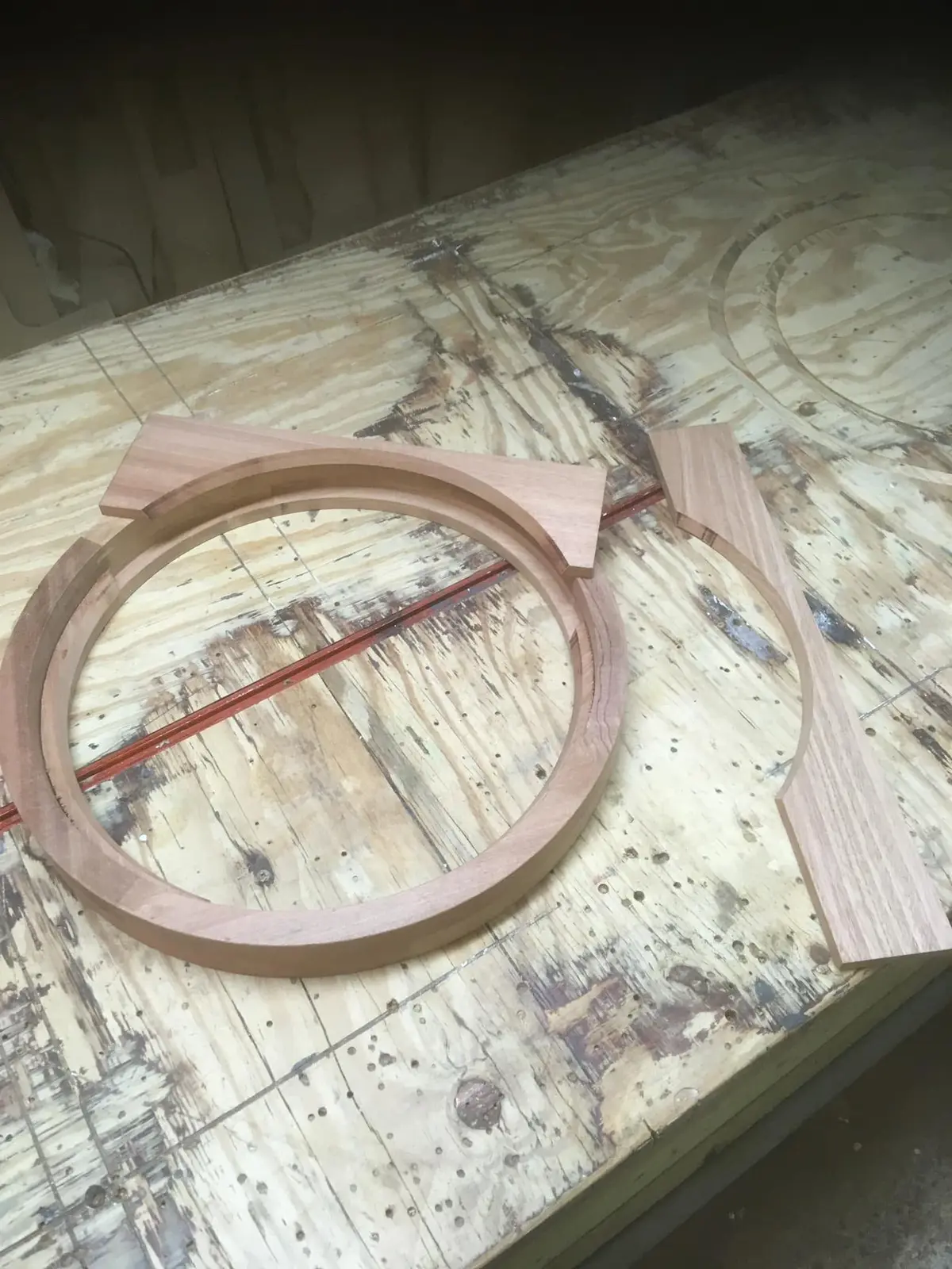 Circular hardwood window frame on the workshop bench